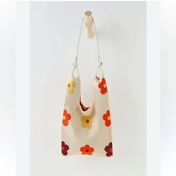 The Lucca Make It Mini Clutch is a knitted bag with a unique unstructured design - Picture 1 of 3